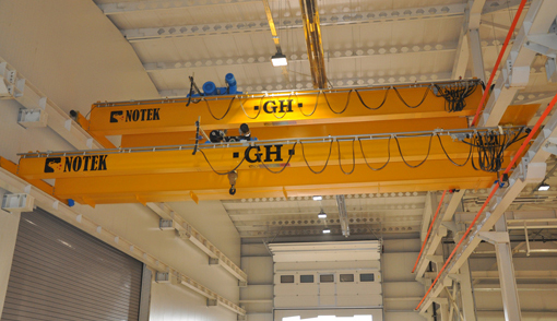 overhead cranes at different heights